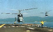 Image: Russian Helix helicopters prepare to land on the USS Belleau Wood.