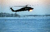 Image: U.S. Army UH-60 Black Hawk helicopter lands during sunset at Kaposvar, Hungary.