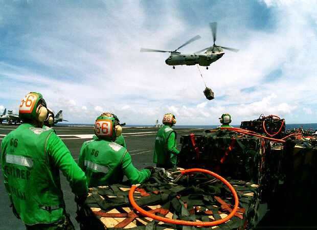 Image: A CH-46 Sea Knight comes in over the USS Constellation.