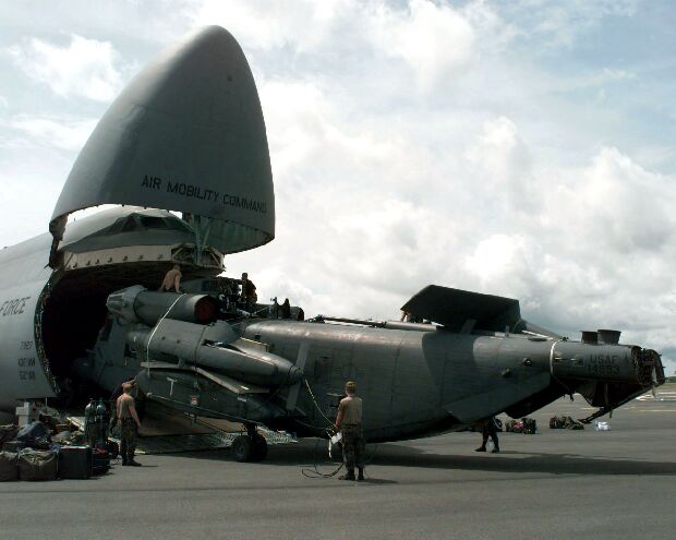 Image: U.S. Air Force MH-53J Pave Low is unloaded from a C-5 at the Libreville Airport.