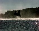 Image: A U.S. Marine jumps into the water from a CH-46E Sea Knight helicopter.