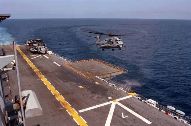 Image: A U.S.M.C. CH-53 Super Stallion helicopter lands on the USS Nassau off the coast of Nova Scotia.