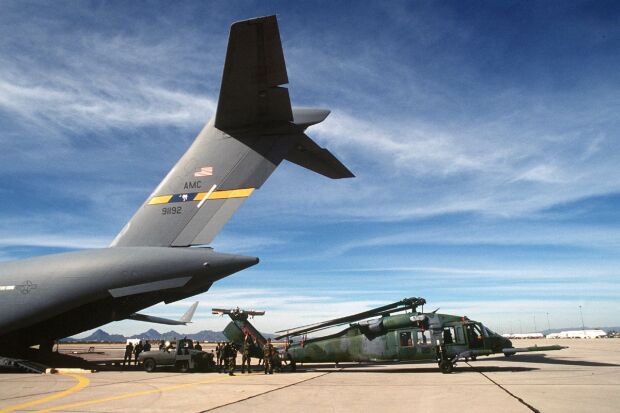 Image: MH-60G helicopter is loaded into C-17A Globemaster III