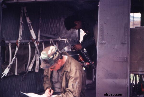 Image: CW4 Proctor filling out logbook