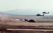 Image: M1-A1 Abrams tanks and AH-64A Apache helicopters