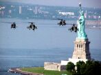 Image: Apache helicopters fly past the Statue of Liberty
